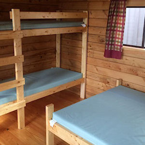 Bunk bed and double bed inside the cabin